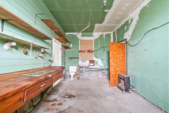 miscellaneous room with concrete floors and sink