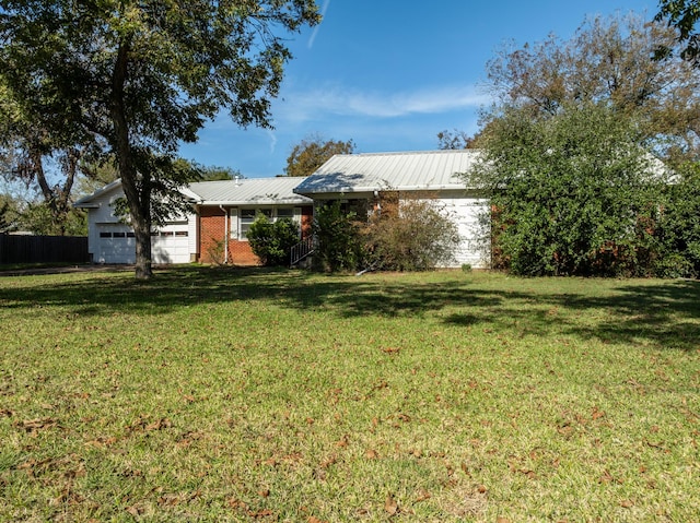 view of yard featuring a garage