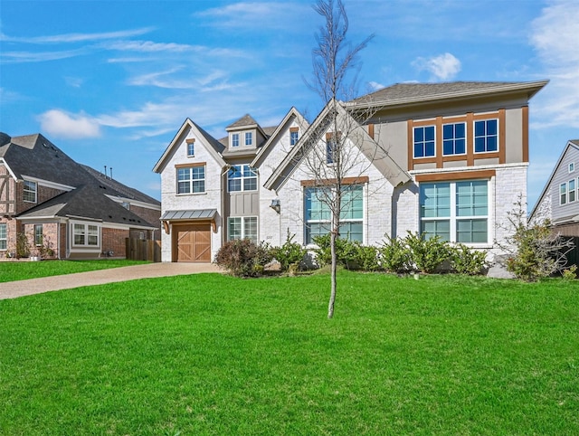 view of front of home featuring a garage and a front yard