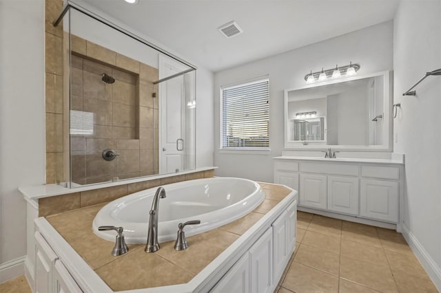 bathroom with vanity, plus walk in shower, and tile patterned flooring