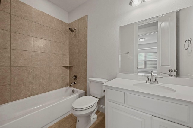 full bathroom with vanity, tiled shower / bath combo, and toilet