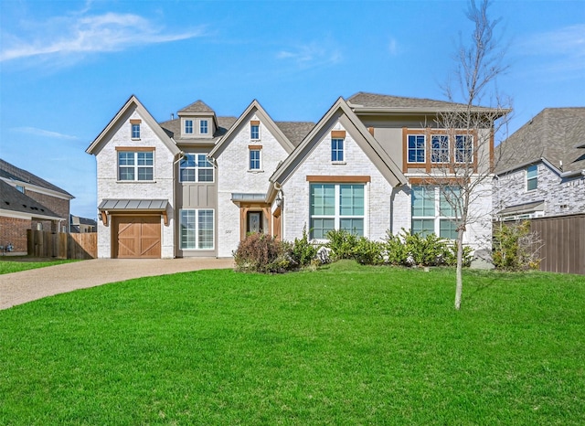 view of front of home featuring a garage and a front yard