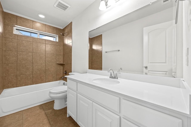 full bathroom featuring toilet, vanity, tiled shower / bath combo, and tile patterned floors