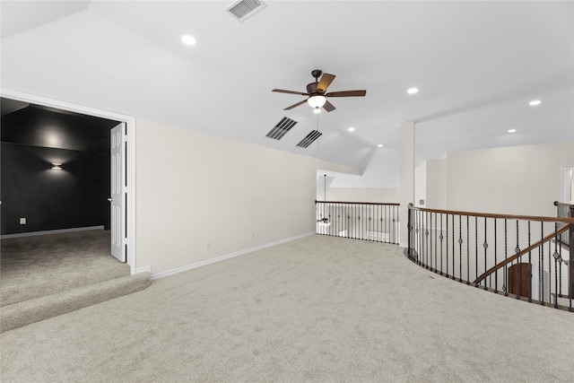 bonus room featuring ceiling fan, light carpet, and lofted ceiling