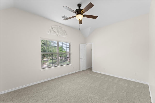 carpeted empty room featuring ceiling fan and lofted ceiling