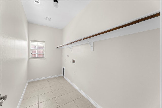 laundry area with hookup for an electric dryer, hookup for a gas dryer, light tile patterned flooring, and washer hookup