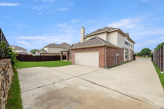 view of side of property featuring a yard