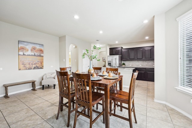 dining room with a healthy amount of sunlight and light tile patterned flooring