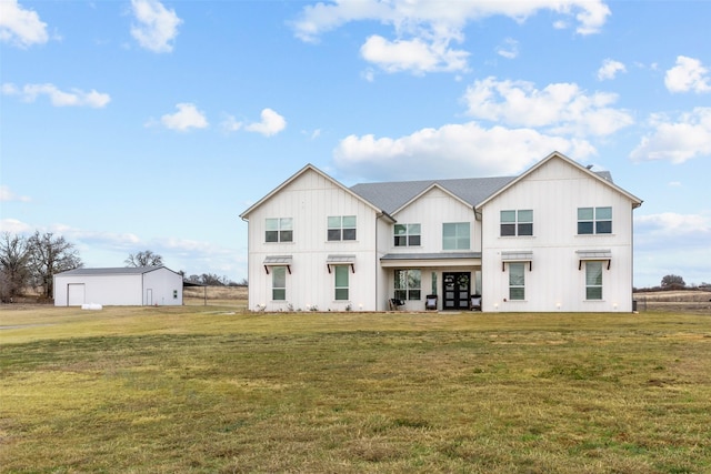 view of front facade with french doors and a front lawn