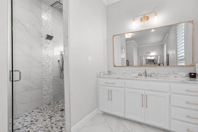 bathroom with vanity, a shower with shower door, and ornamental molding