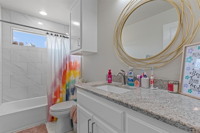 full bathroom with shower / tub combo with curtain, vanity, and toilet