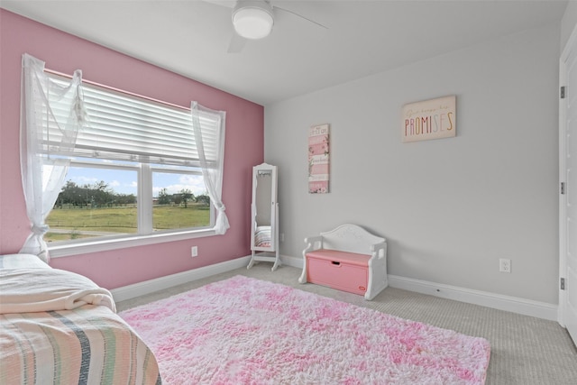 bedroom with ceiling fan and light colored carpet