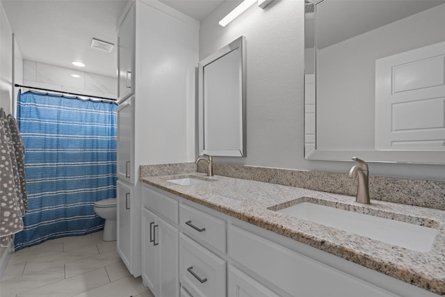 bathroom featuring vanity, toilet, and a shower with shower curtain