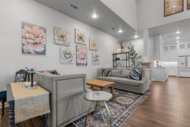 living room with dark hardwood / wood-style flooring