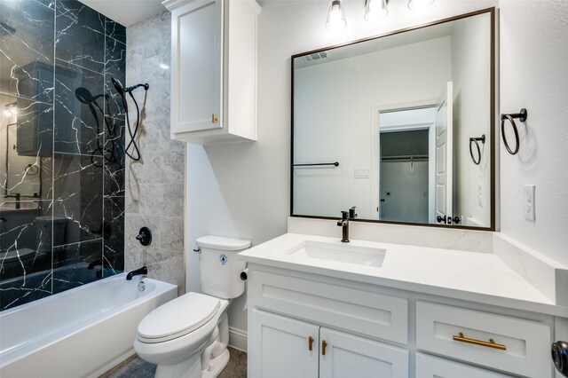 full bathroom featuring vanity, toilet, and tiled shower / bath combo