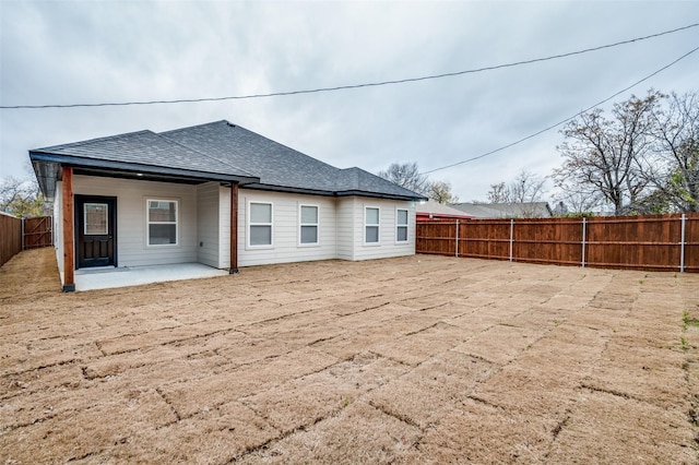 back of house with a patio