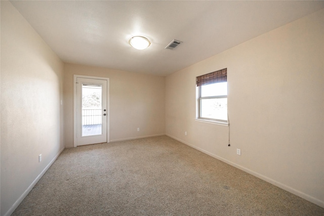 unfurnished room featuring carpet floors