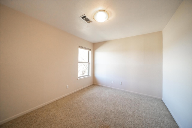 empty room with carpet flooring