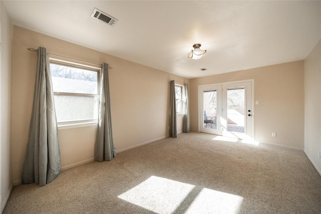 empty room featuring light colored carpet