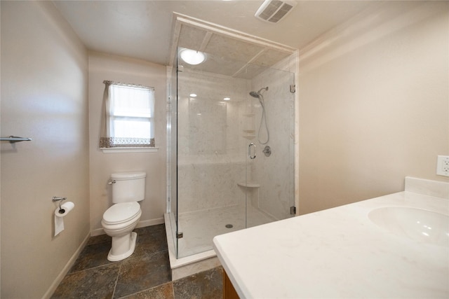 bathroom featuring vanity, toilet, and an enclosed shower