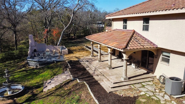 view of patio featuring cooling unit