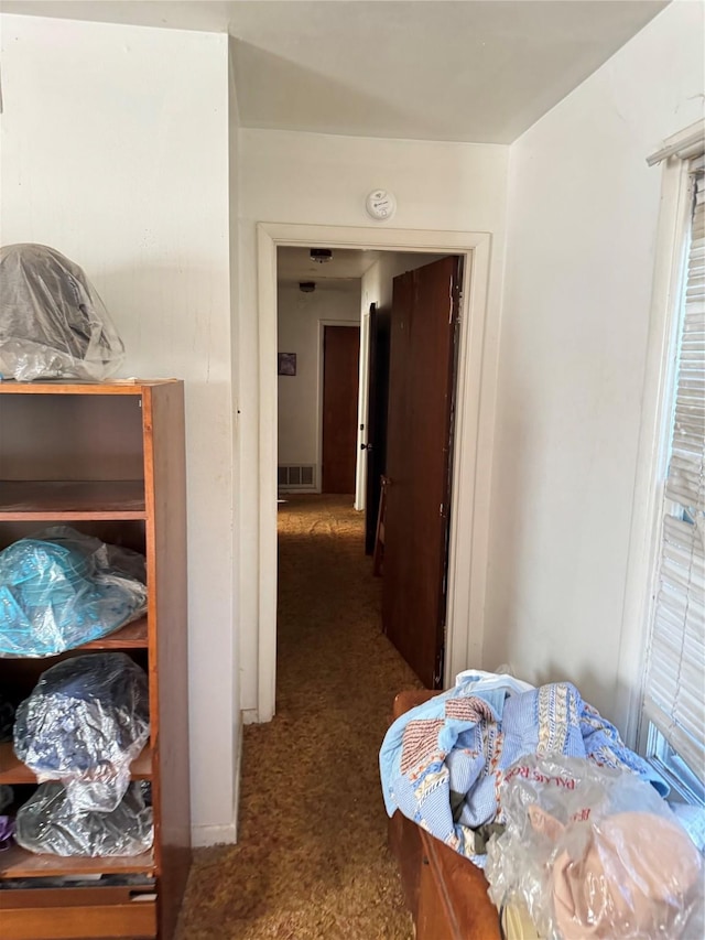 corridor featuring carpet flooring