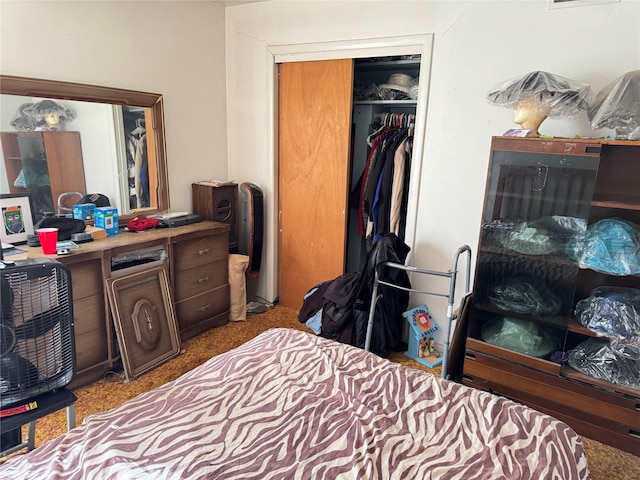 carpeted bedroom featuring a closet