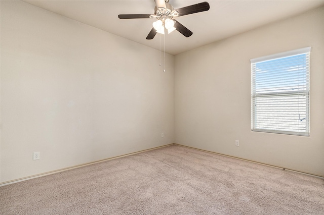 unfurnished room with ceiling fan and light colored carpet