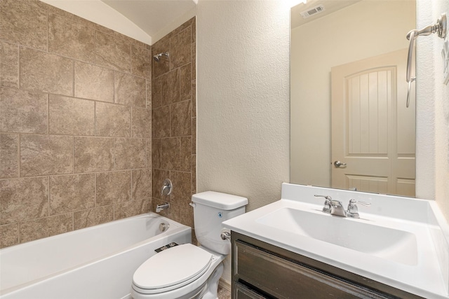 full bathroom with vanity, toilet, and tiled shower / bath combo