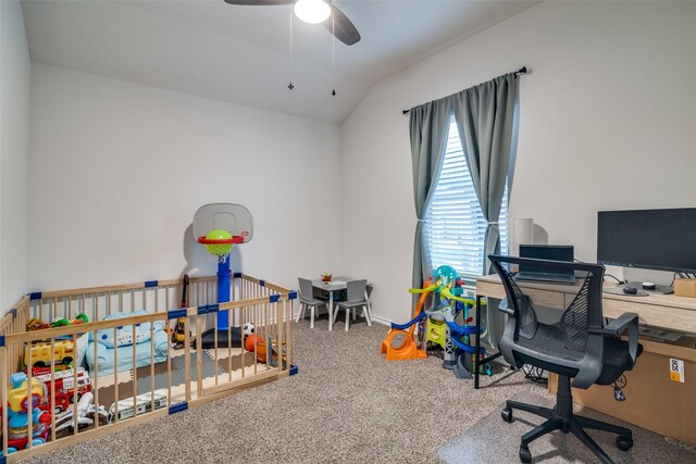 home office featuring lofted ceiling, ceiling fan, and carpet