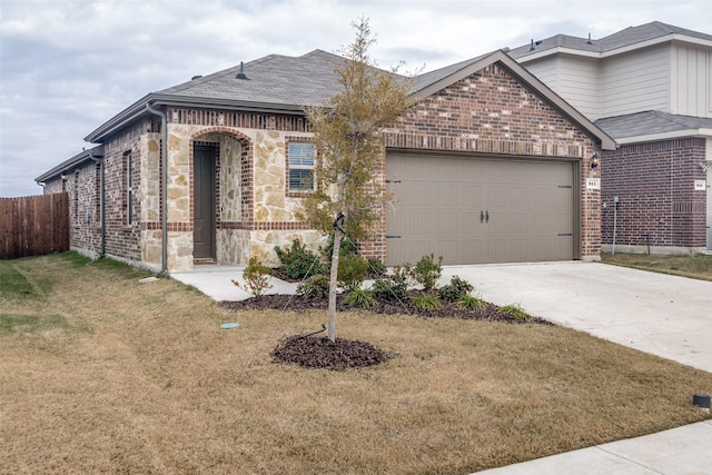 view of front facade with a front lawn and a garage