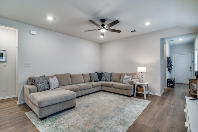 living room featuring hardwood / wood-style floors and ceiling fan