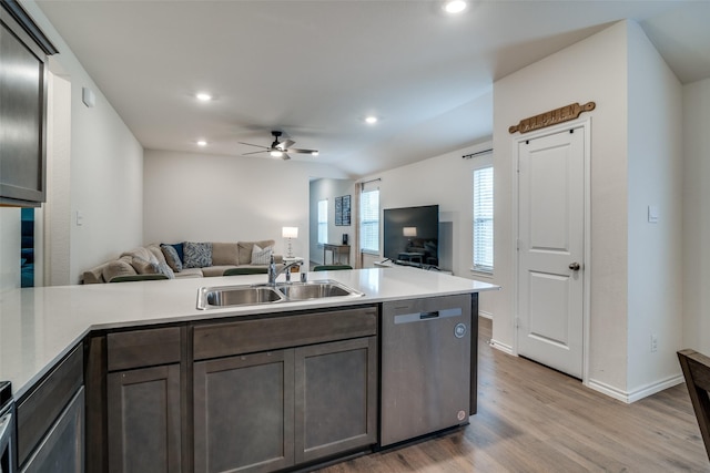 kitchen with sink, dishwasher, ceiling fan, dark brown cabinets, and light hardwood / wood-style floors