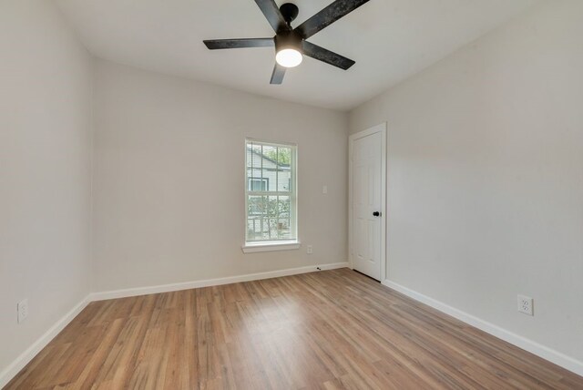 unfurnished room featuring ceiling fan and light hardwood / wood-style floors