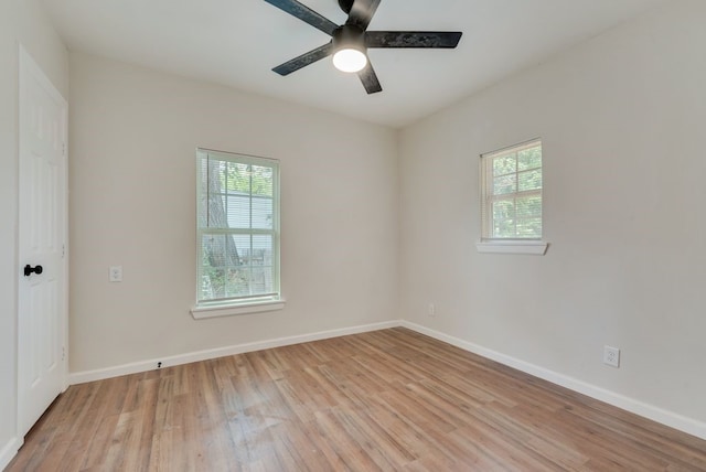 spare room with ceiling fan and light hardwood / wood-style floors