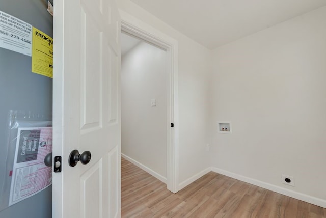 laundry room featuring hookup for a washing machine and light hardwood / wood-style floors