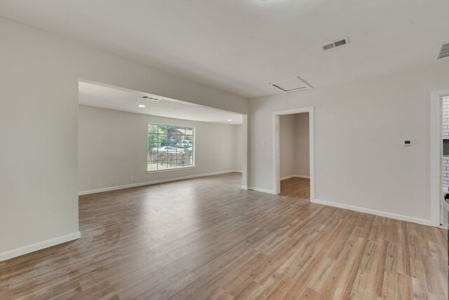 unfurnished room featuring light hardwood / wood-style floors