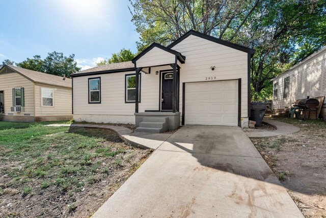 ranch-style home featuring a garage