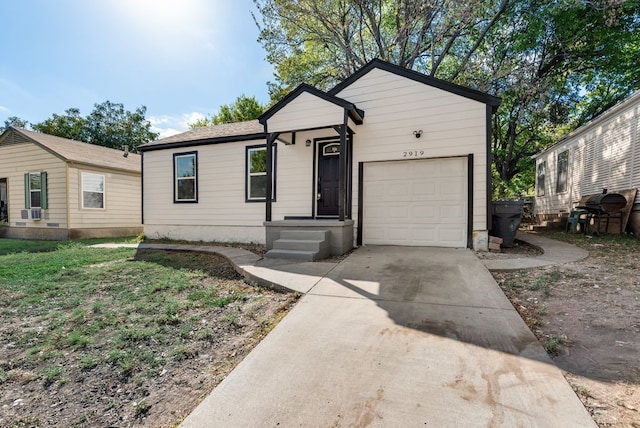 single story home with a garage