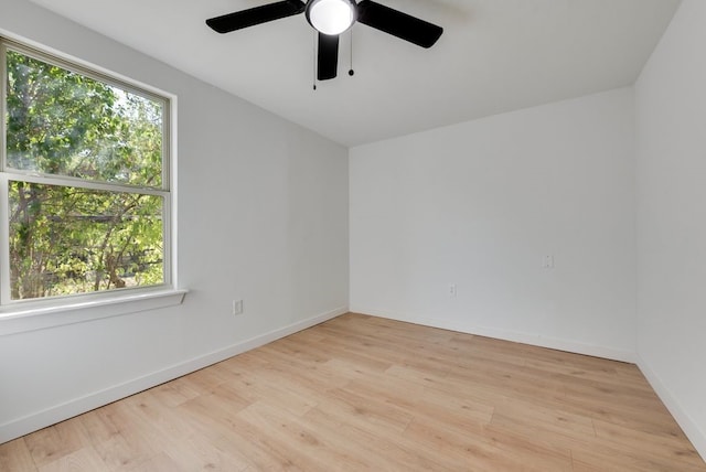 unfurnished room with light wood-type flooring