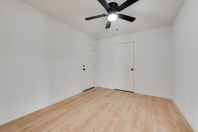 unfurnished room featuring ceiling fan and light wood-type flooring