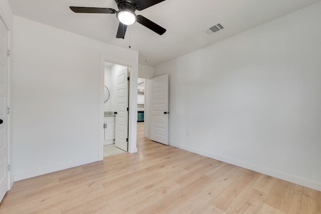 unfurnished bedroom with ceiling fan, connected bathroom, and light hardwood / wood-style floors