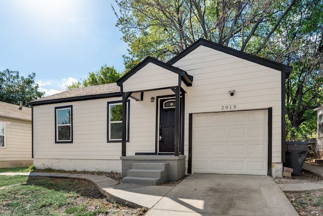 ranch-style home featuring a garage