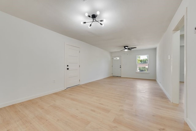 spare room featuring ceiling fan and light wood-type flooring