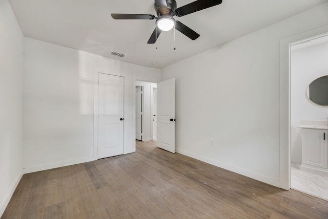 spare room with ceiling fan and light hardwood / wood-style floors