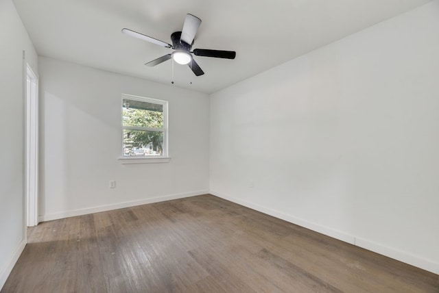 empty room with wood-type flooring and ceiling fan