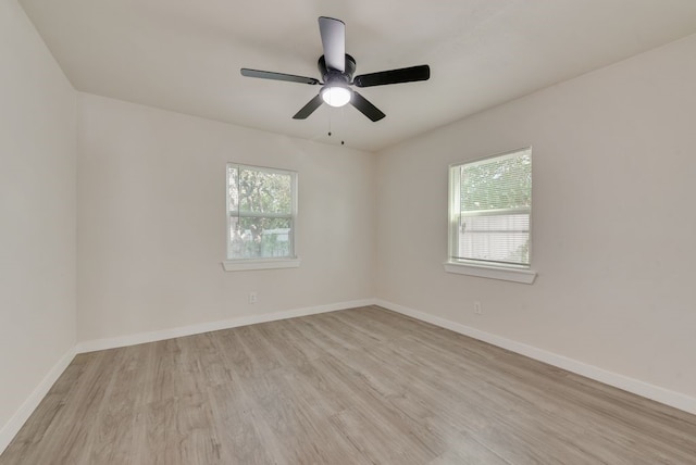 spare room with ceiling fan and light hardwood / wood-style flooring