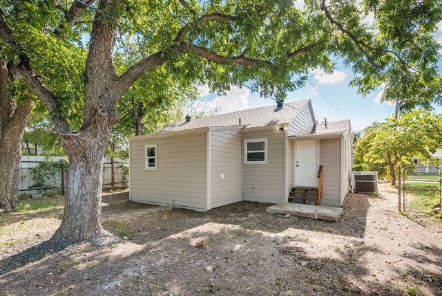 back of property with central AC unit