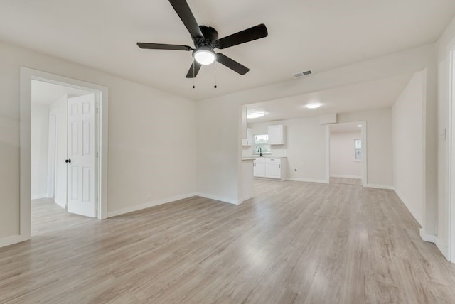 unfurnished living room featuring light wood-type flooring and ceiling fan