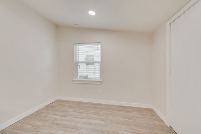 empty room with light hardwood / wood-style floors